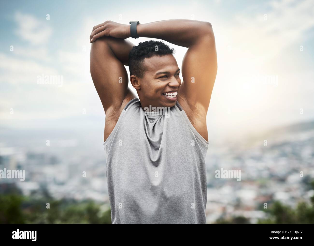 Young man stretching arm sunrise hi-res stock photography and images ...