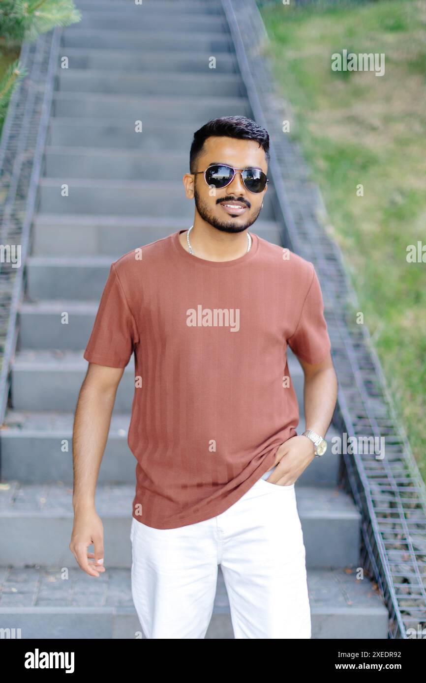 Indian man standing outdoors hi-res stock photography and images - Alamy