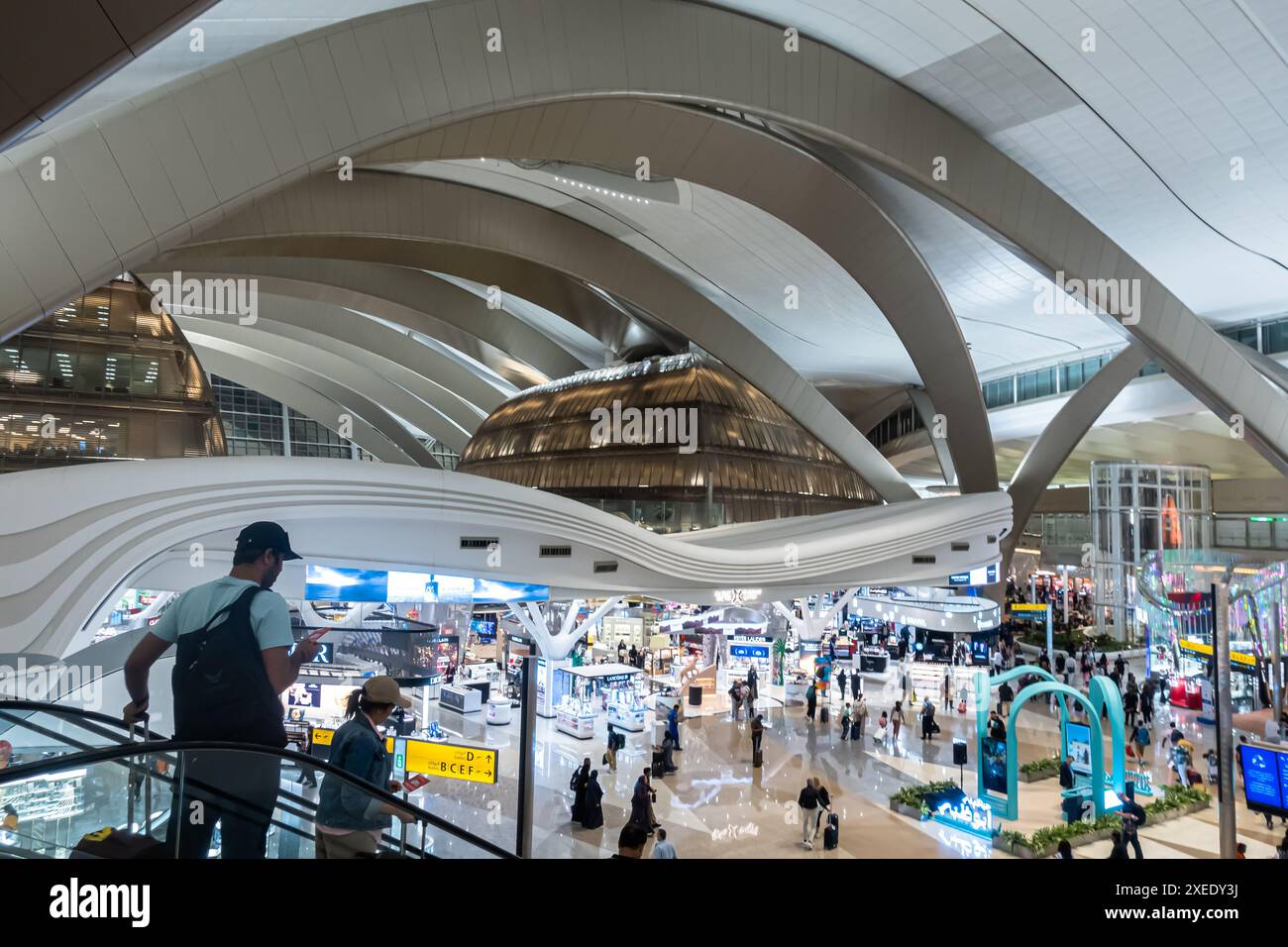 Tourists on the escalator, interior of Zayed International Airport, Abu Dhabi, UAE, United Arab Emirates, Asia Stock Photo