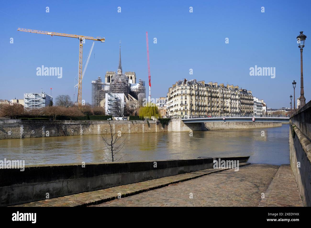 Cityscape with Notre Dame in restoration, the medieval Catholic ...