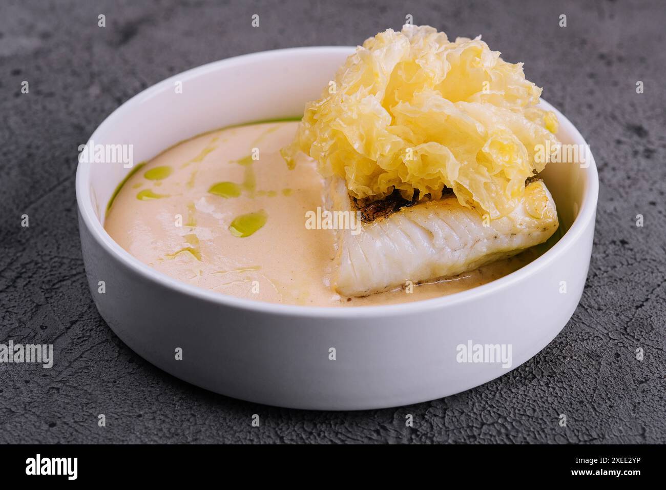 F4ied Cod Filet fried cod fish filet with sauce hollandaise Stock Photo - Alamy