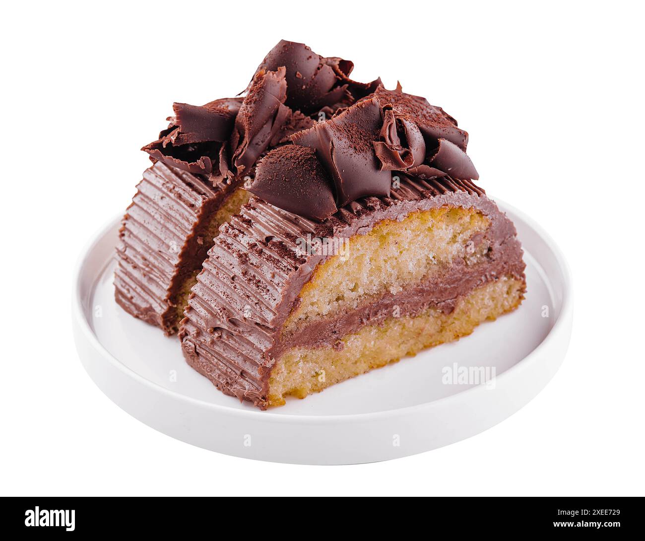 Chocolate roll with cream on a white plate Stock Photo