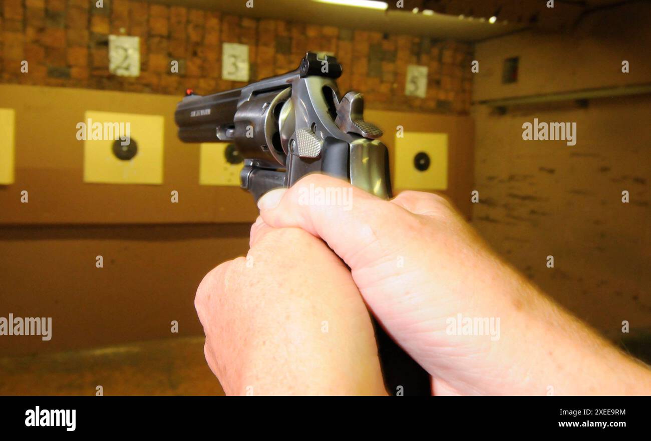 Target shooter at a shooting range Stock Photo