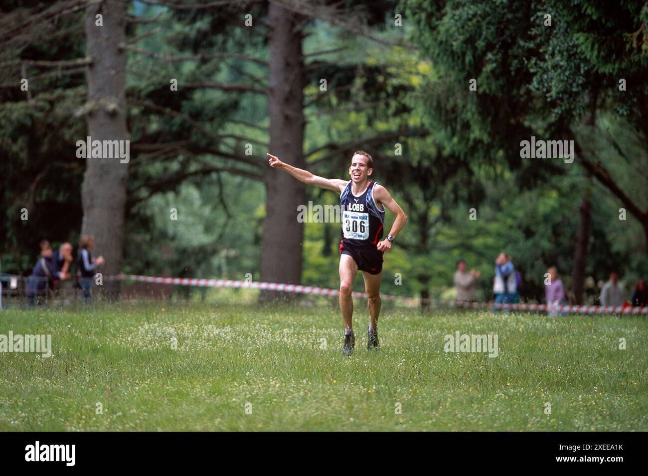 Huw Lobb crossing the finishing line in 2004 to become the first runner to win the annual Man versus Horse Marathon, held annually over 22 miles of very rough country near Llanwrtyd Wells in mid-Wales, UK. He won with a time of 2 hours 5 minutes and 19 seconds, just 2m and 17secs ahead of the first horse to finish Stock Photo