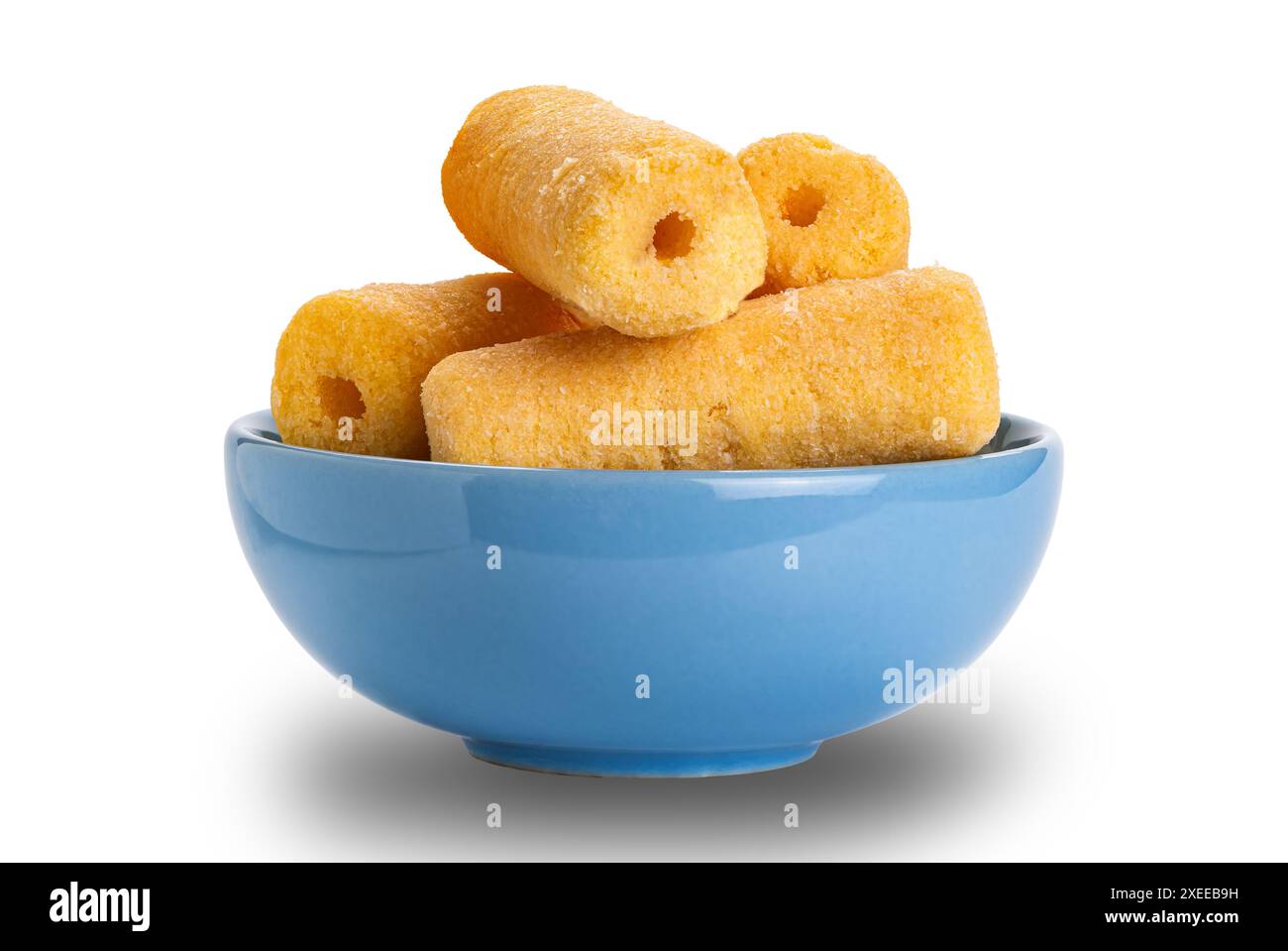 Roller corn snack in blue ceramic bowl isolated on white background. Stock Photo