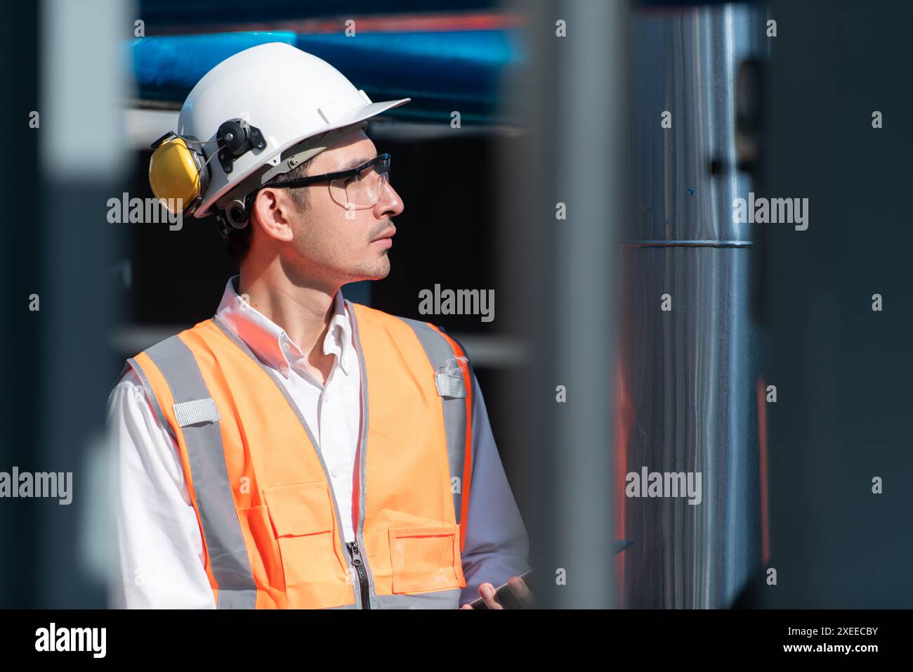 Engineers inspect the completed air conditioning and water systems to continue verifying their functionality. Stock Photo