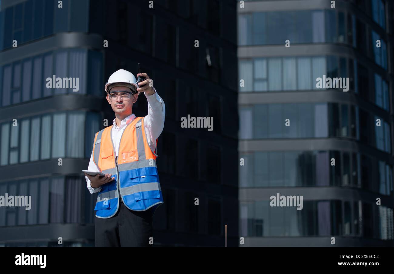 Engineers inspect the completed air conditioning and water systems to continue verifying their functionality. Stock Photo