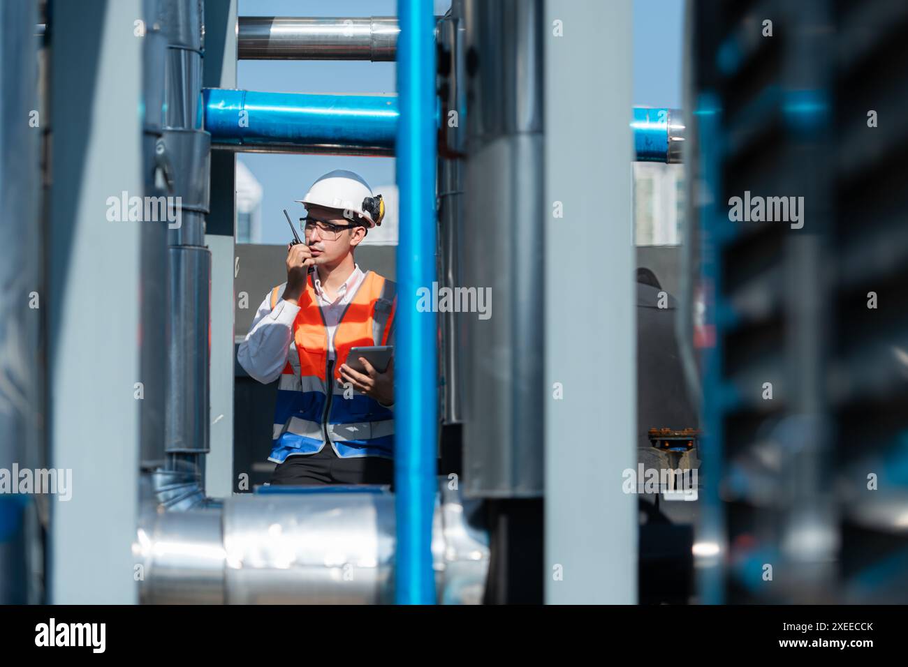 Engineers inspect the completed air conditioning and water systems to continue verifying their functionality. Stock Photo
