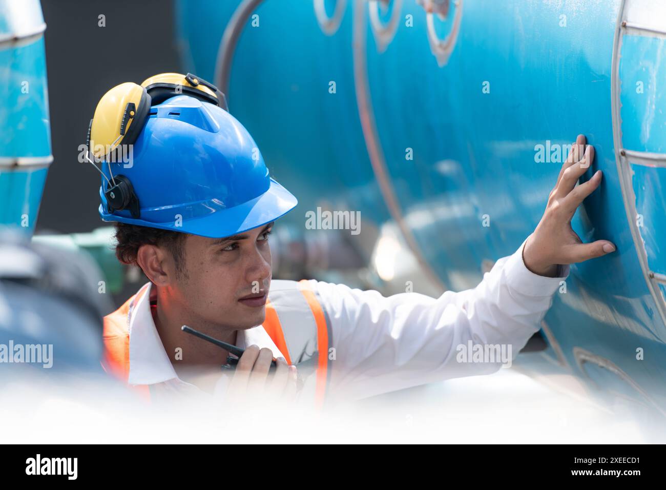 Engineers inspect the completed air conditioning and water systems to continue verifying their functionality. Stock Photo