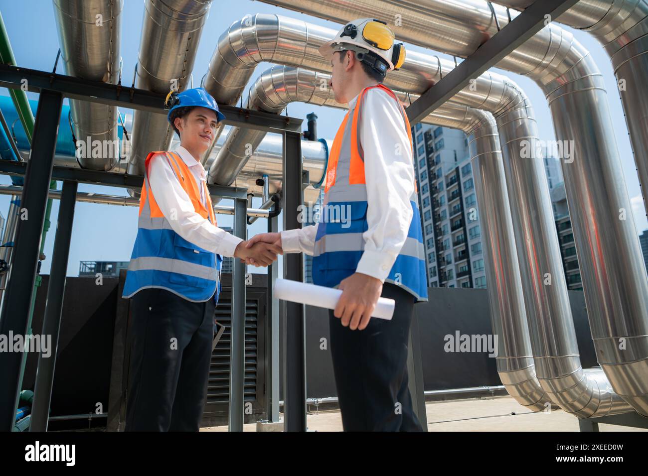 Engineers and technicians Inspect the completed air conditioning and water systems to continue verifying their functionality. Stock Photo