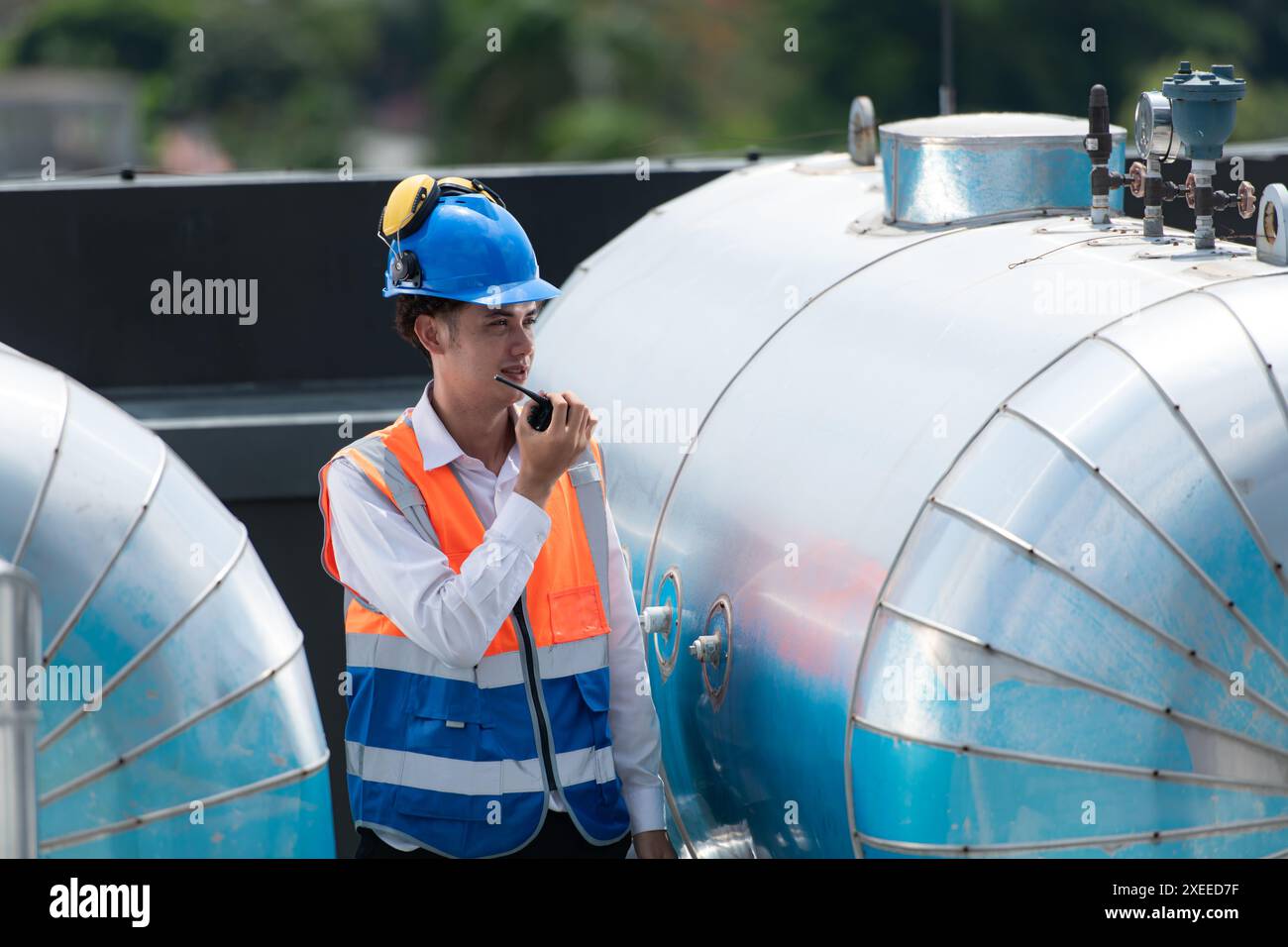 Engineers inspect the completed air conditioning and water systems to continue verifying their functionality. Stock Photo