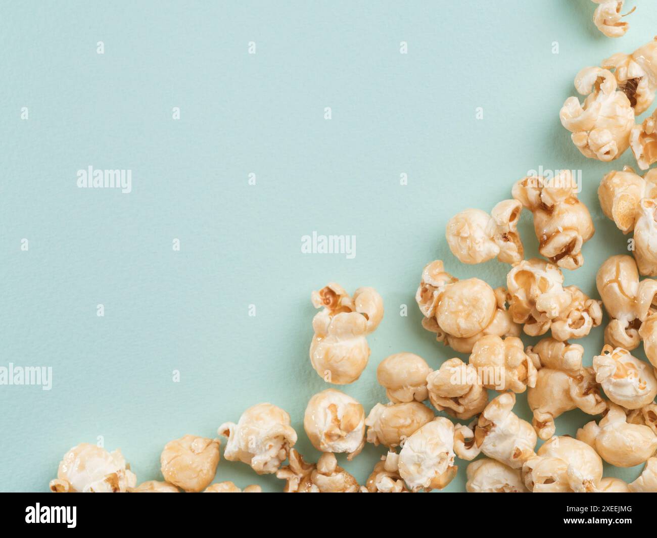 Popcorn on blue background with copy space Stock Photo