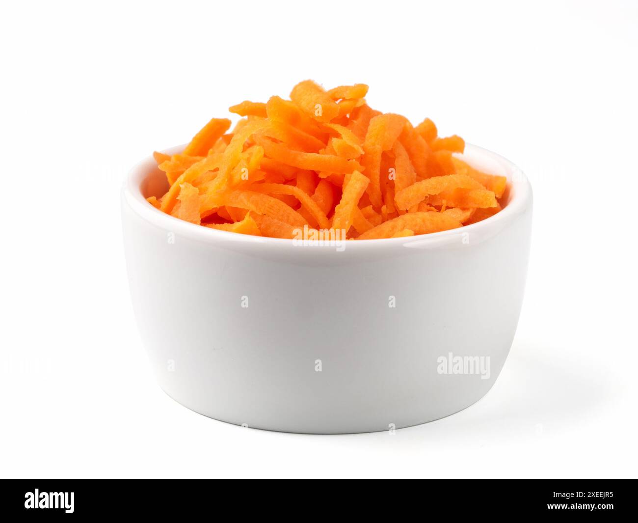 Grated carrots isolated on white Stock Photo