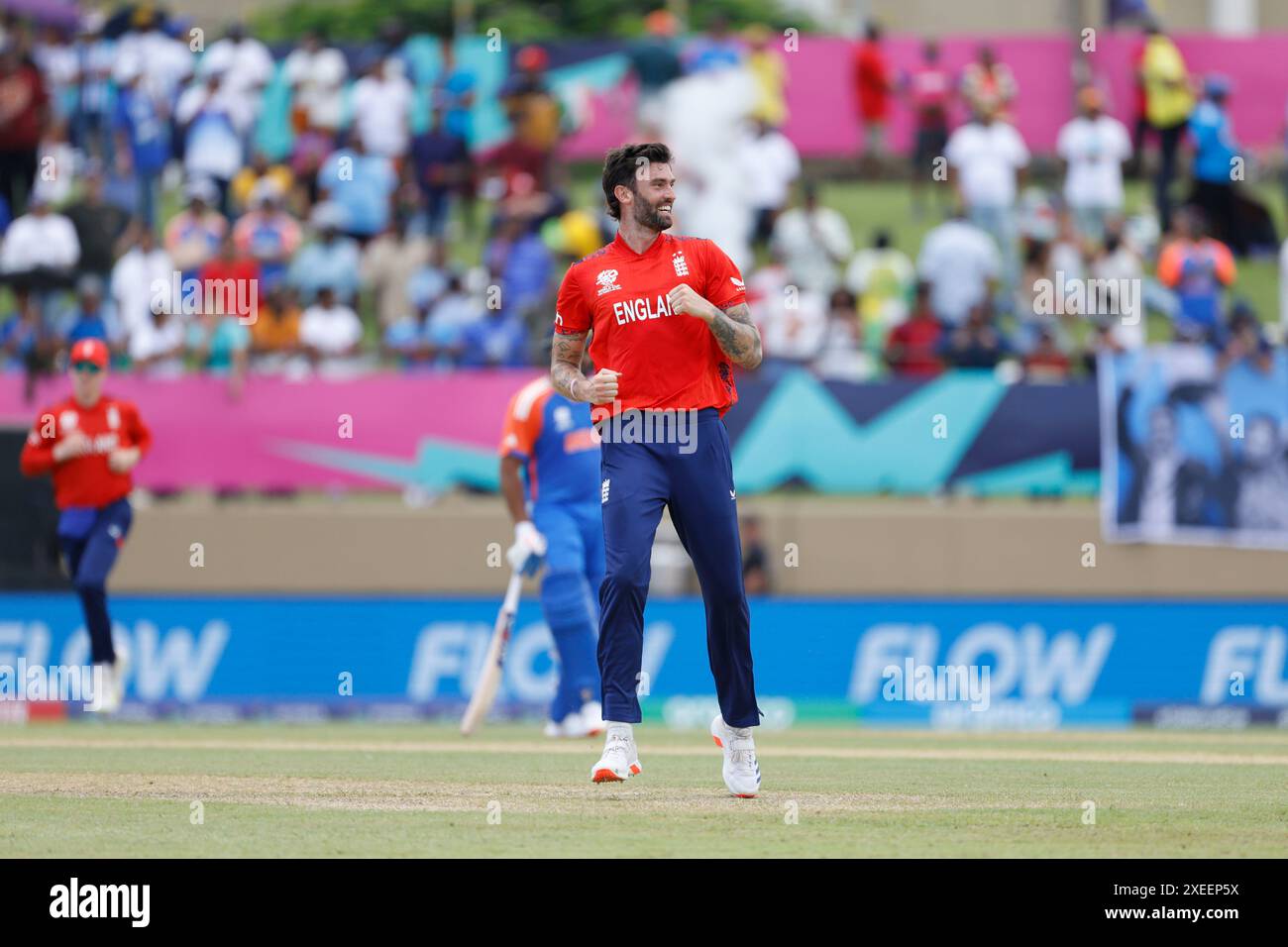 England's Reece Topley celebrates after taking the wicket of India's ...