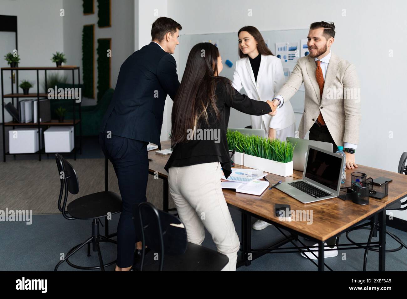 Conclusion of an agreement between office workers with the conclusion of a deal Stock Photo