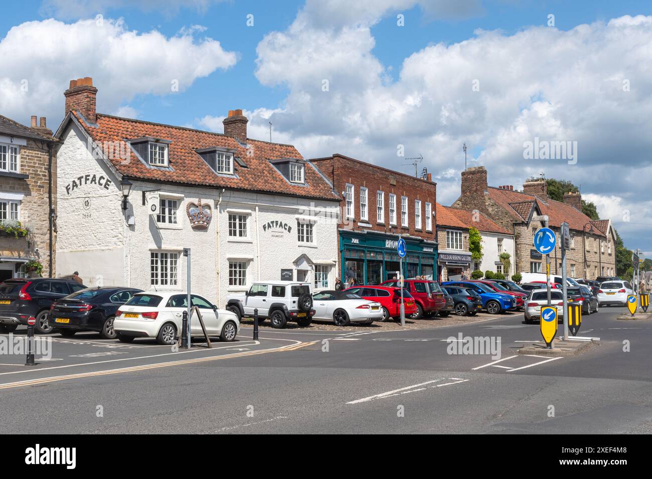 View of the market place in Helmsley town centre, North Yorkshire, England, UK, with shops Stock Photo