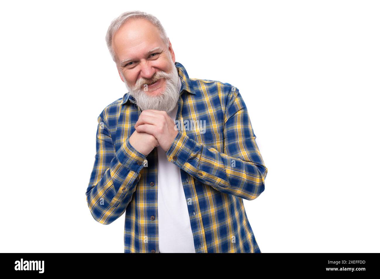 Charming well-groomed senior pensioner gray-haired man with a beard in a shirt Stock Photo