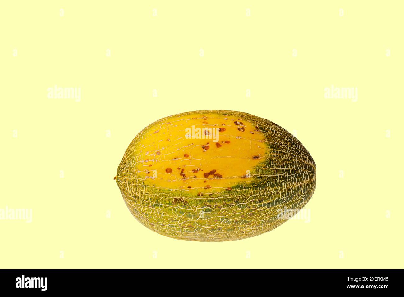 Close-up view of ripe melon isolated on yellow background Stock Photo ...