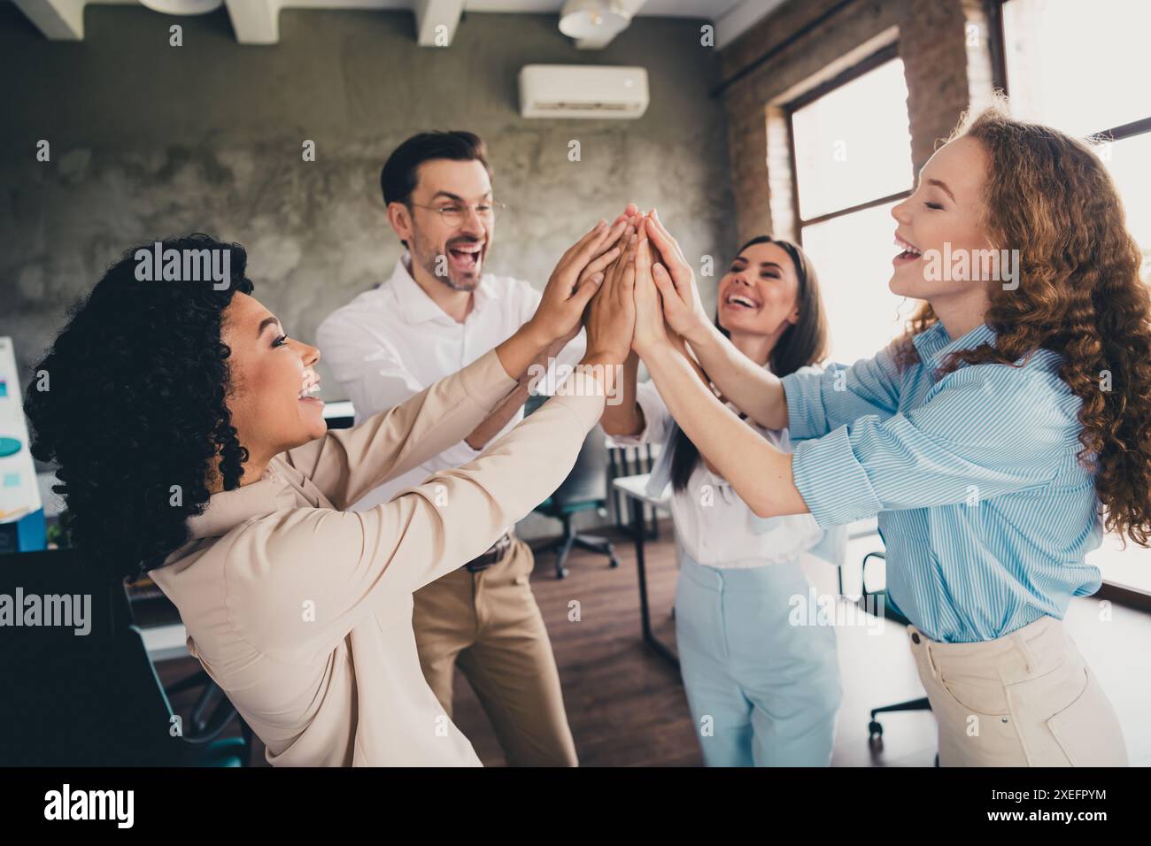 Photo of glad professional cheerful people hands touch achieve success ...