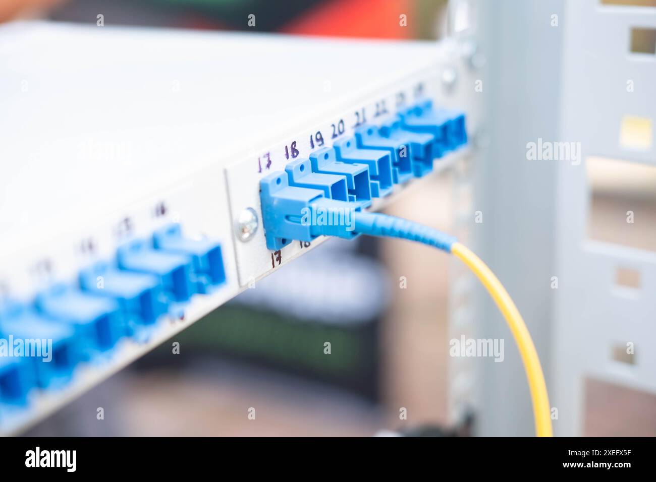 Connector with blue cables. Blur and selective focus Stock Photo