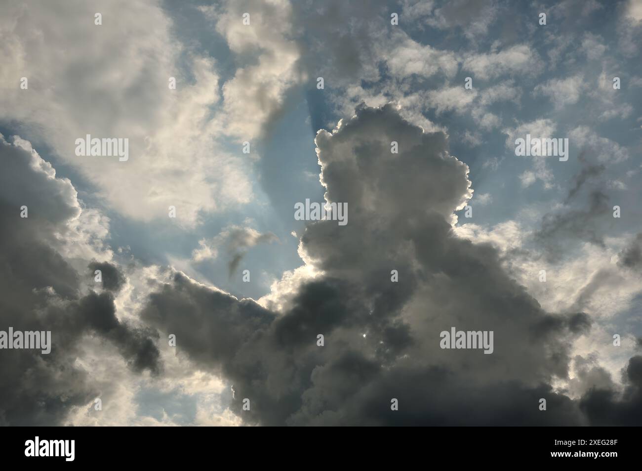 Clouds in the sky. The sun behind the clouds. Stock Photo
