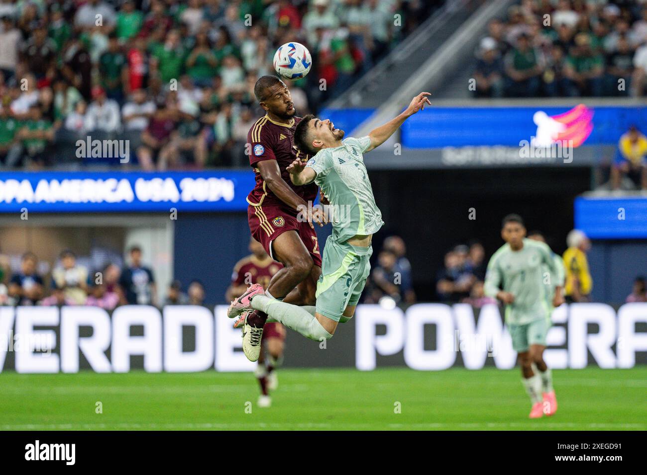 Venezuela forward José Salomón Rondón (23) and Mexico defender Johan Vásquez (5) battle for possession during the Copa América group stage, Wednesday, Stock Photo