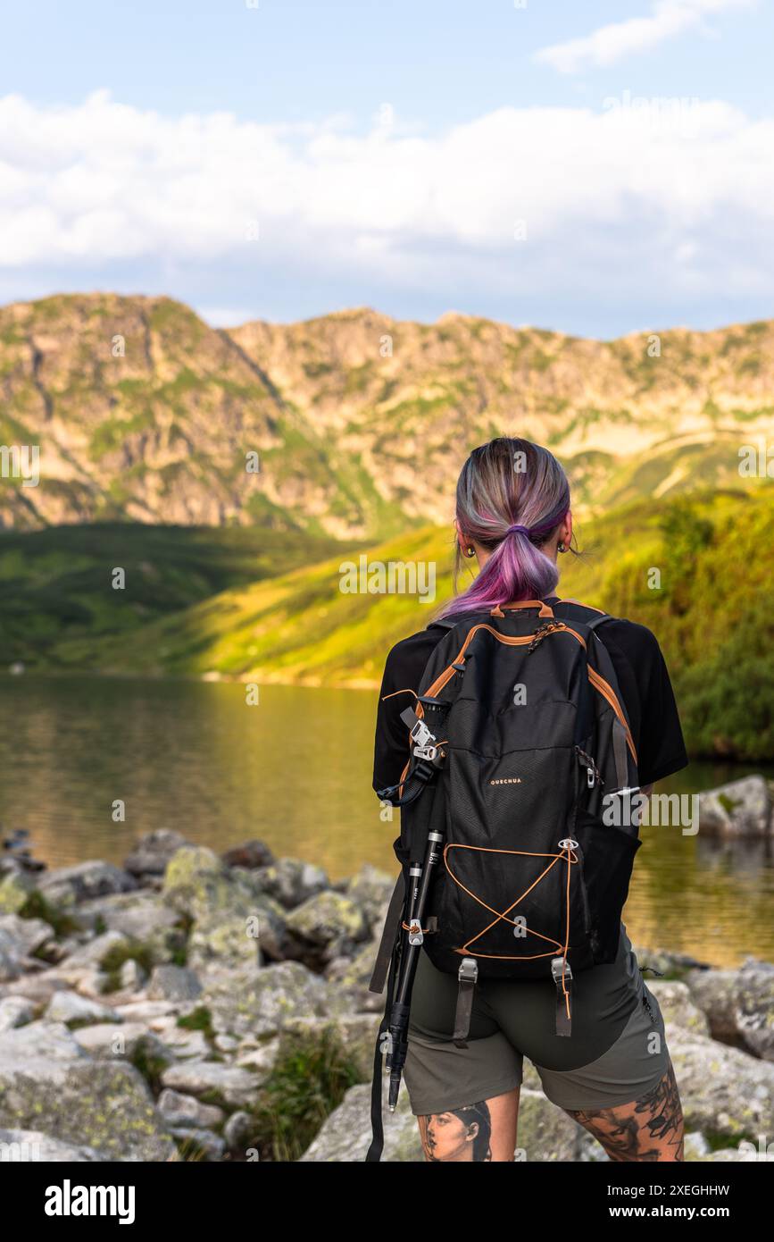 Back view young female tourist hi-res stock photography and images - Alamy
