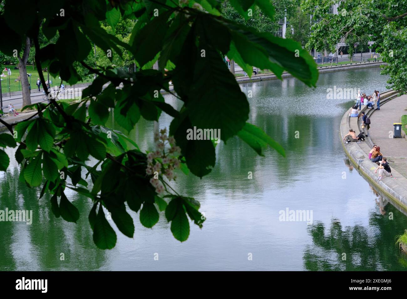 People relaxing along the Canal Saint-Martine in a Spring day. Paris.France Stock Photo