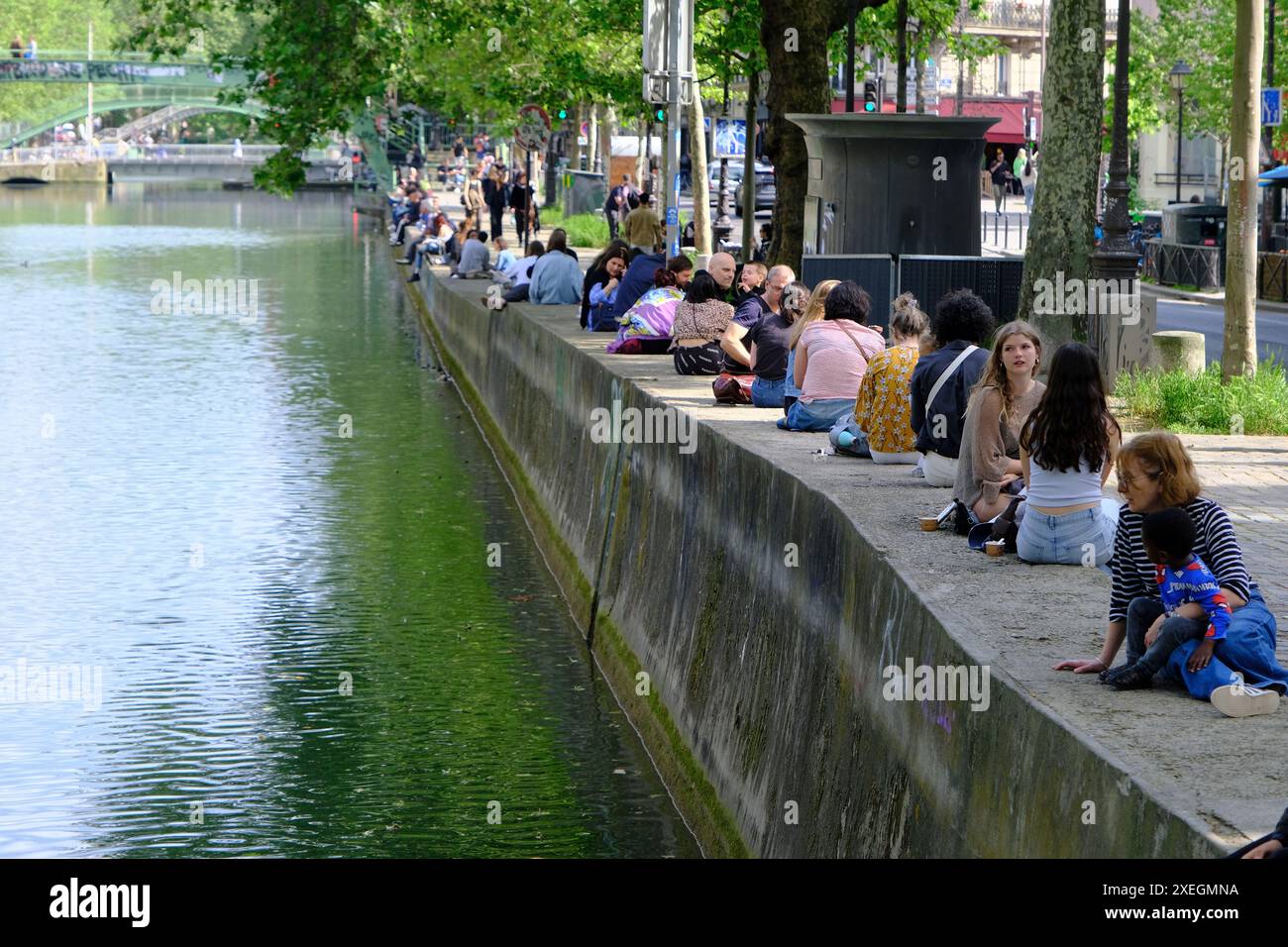People relaxing along the Canal Saint-Martine in a Spring day. Paris.France Stock Photo
