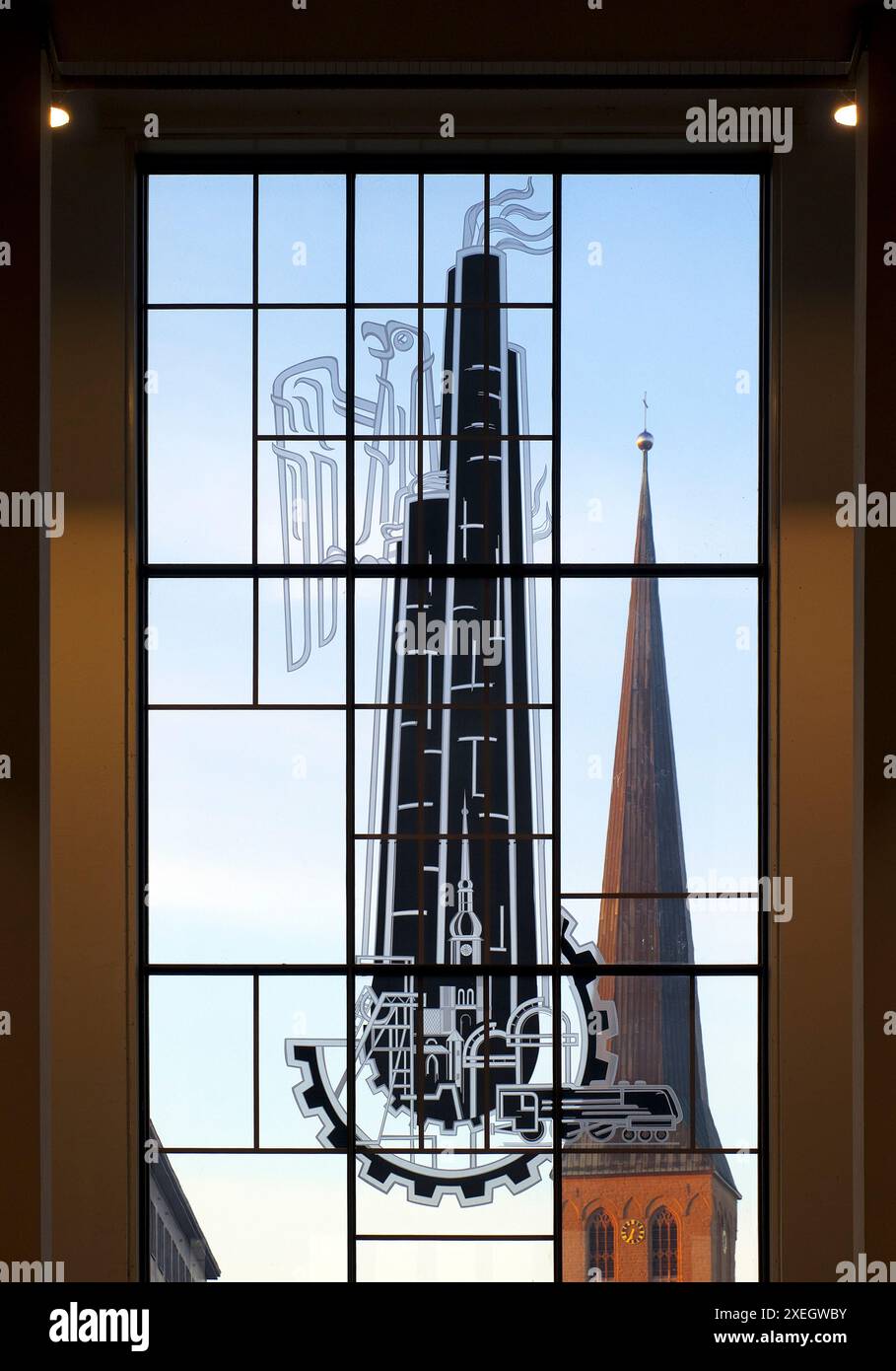 View through the glass front of the main train station with a pictorial glass window, Dortmund Stock Photo