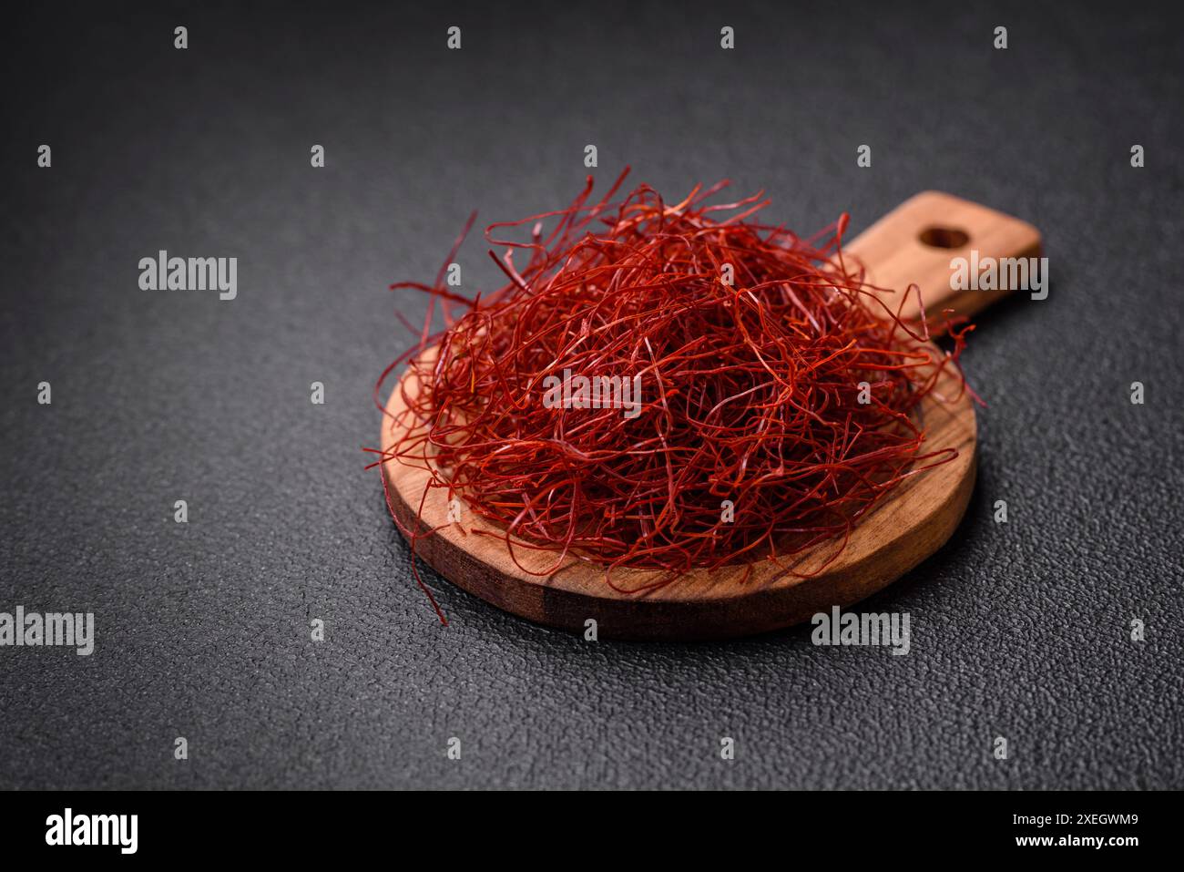 Chilly Thread Red thin hot chili threads on a dark background. For decorating Asian ...