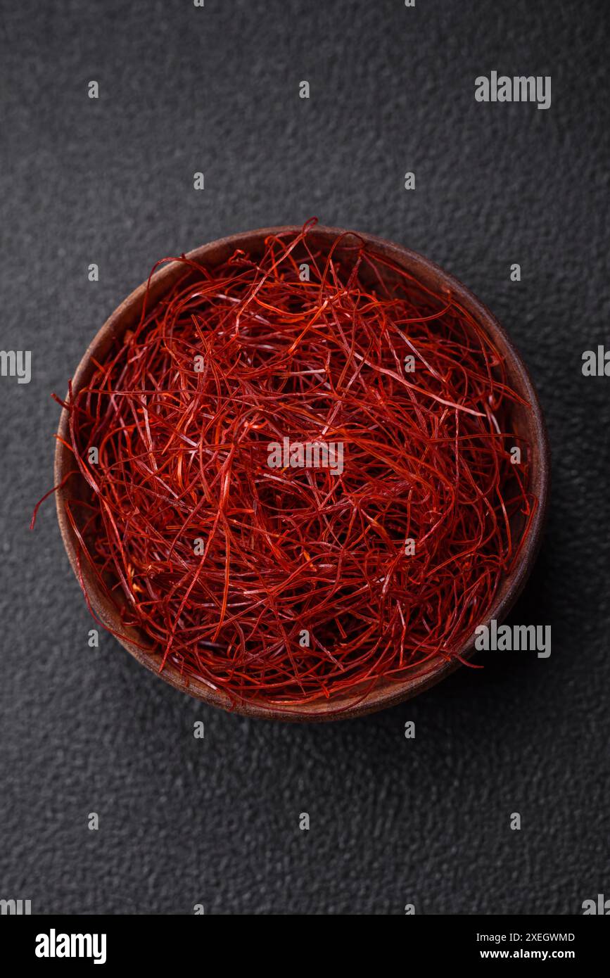 Red thin hot chili threads on a dark background. For decorating Asian ...
