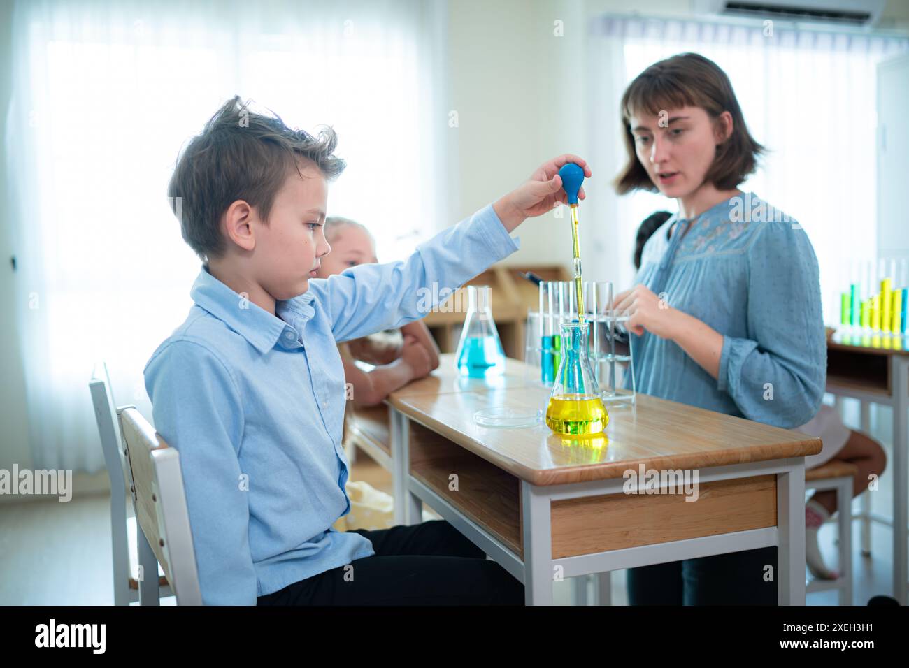 Teacher and students, Learn and experiment with science in a school ...