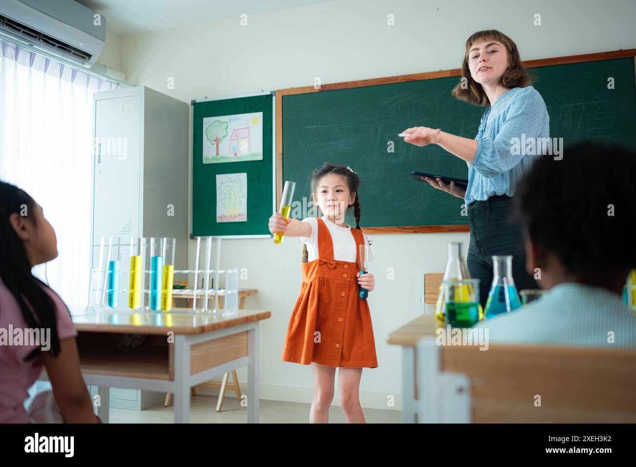 Teacher and students, Learn and experiment with science in a school ...
