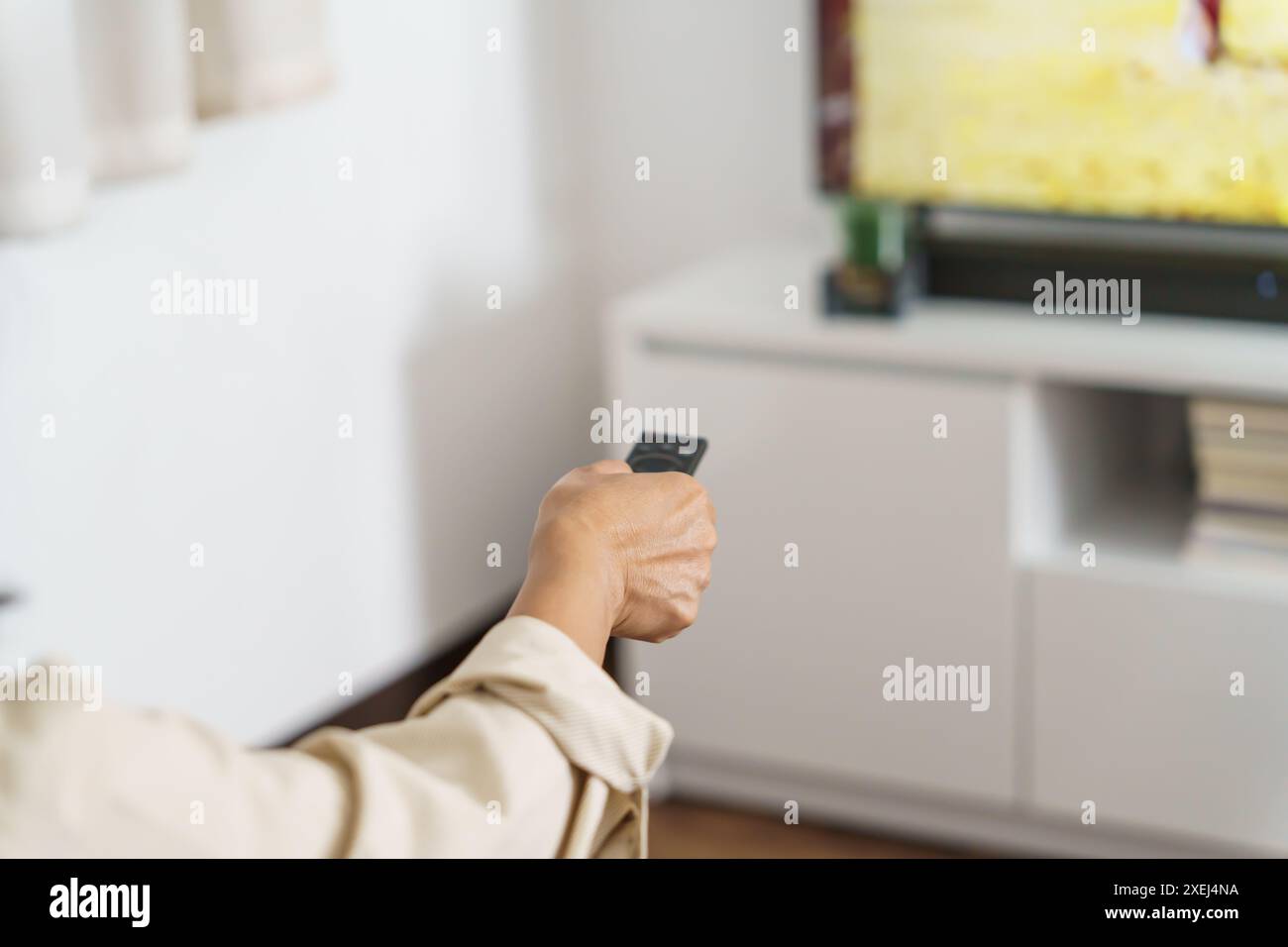 Elderly woman Watching smart TV and using remote controller Hand ...