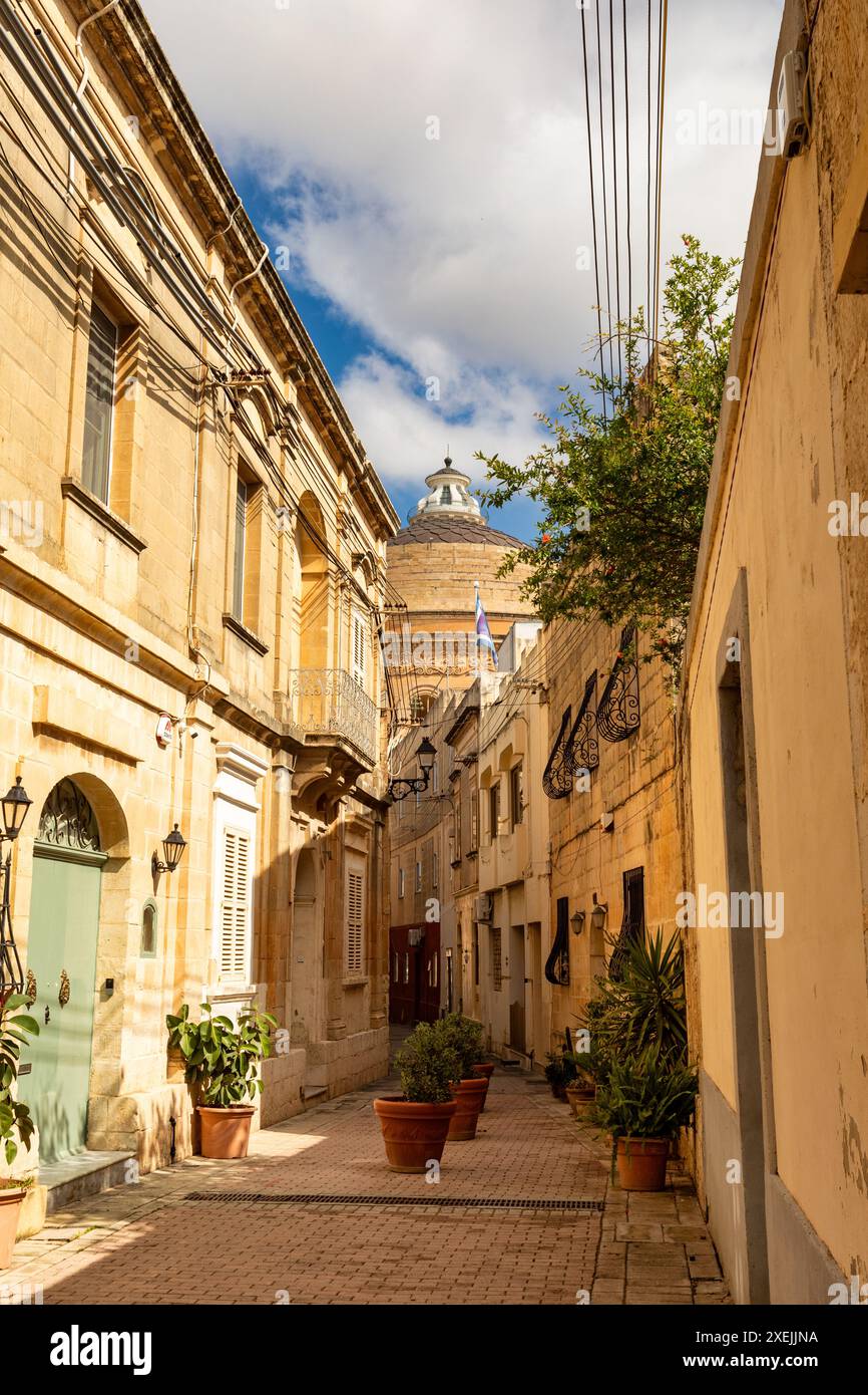 Narrow, winding alleyway in Mosta ancient core reveals historic ...