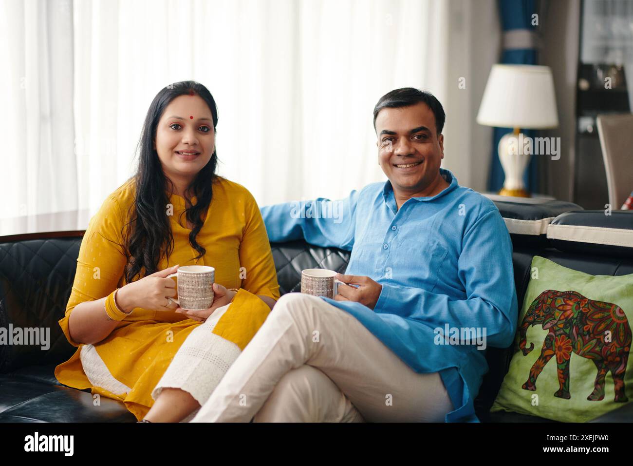 Happy Indian Couple Drinking Tea Stock Photo