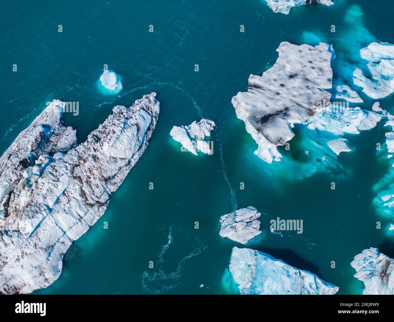 Aerial view of the big pieces of ice from glacier, ice islands, glacier and mountains, Jokulsarlon Stock Photo