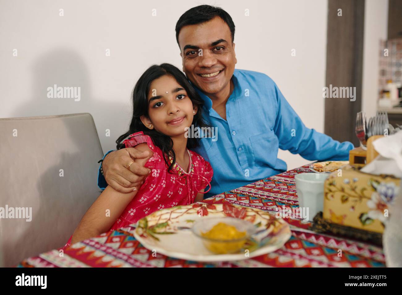 Indian family having dinner hi-res stock photography and images - Alamy