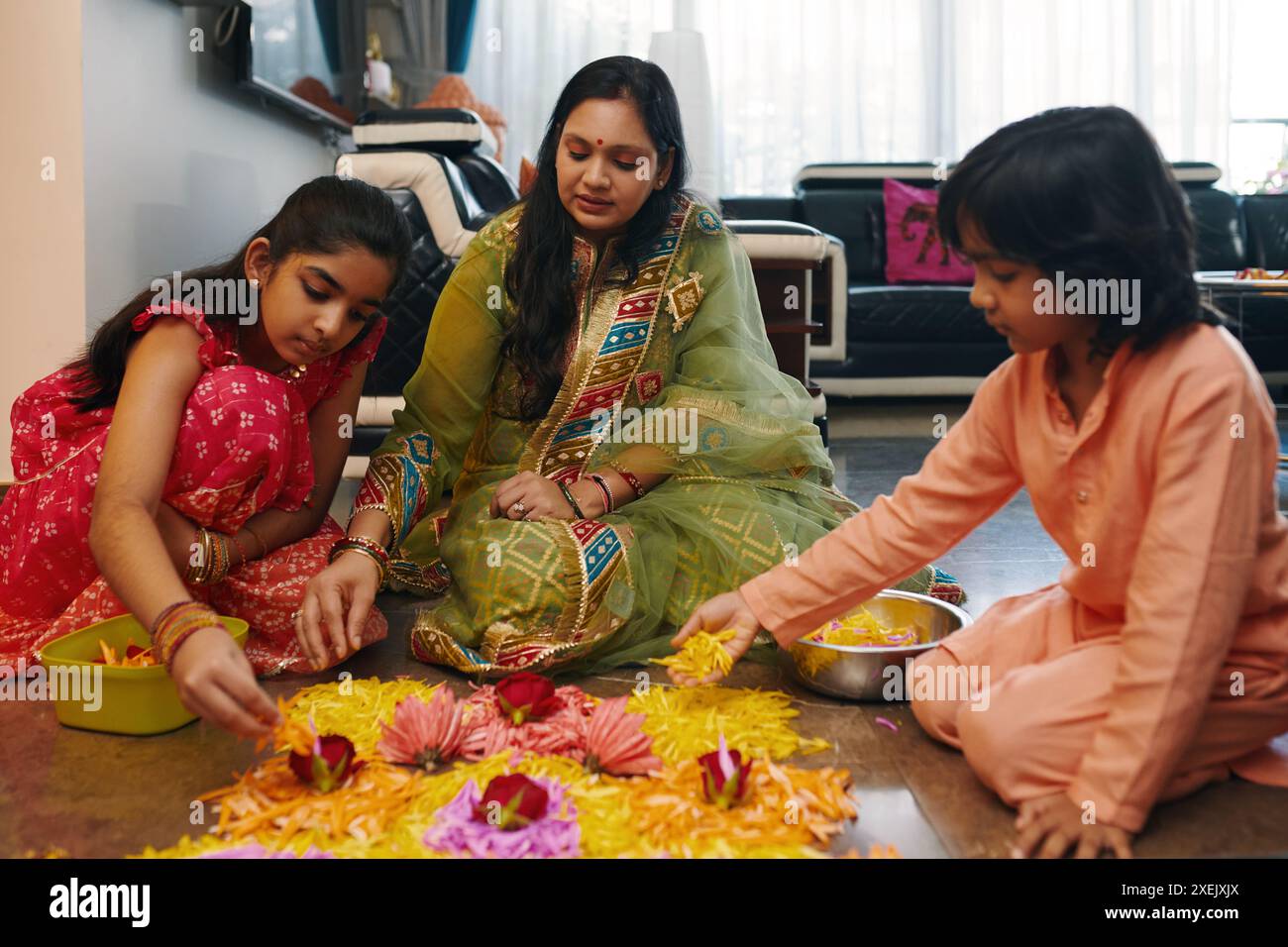 Mother daughter making rangoli hi-res stock photography and images - Alamy