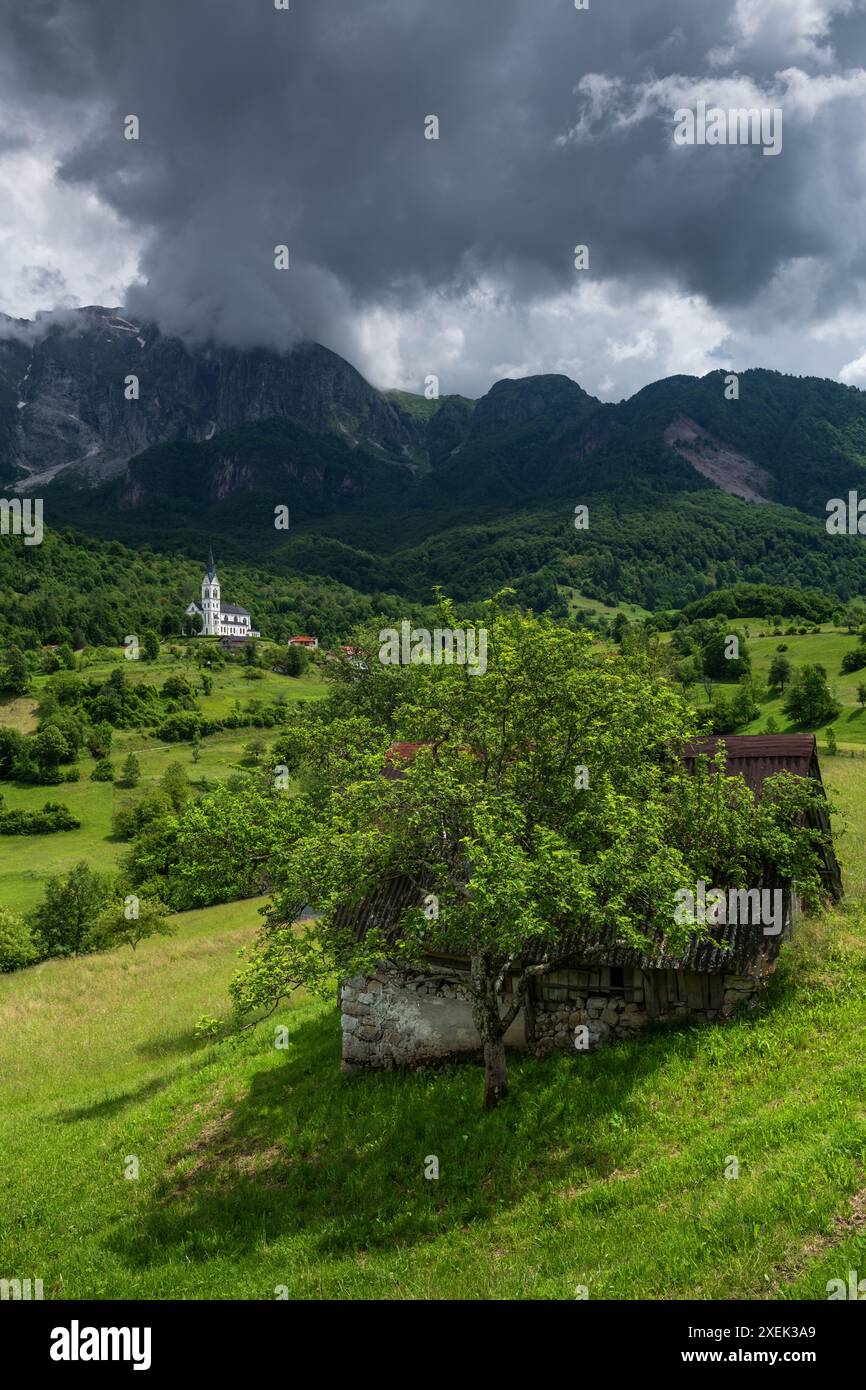 Charming Dreznica Village with Breathtaking Mount Krn in Picturesque Slovenia Stock Photo