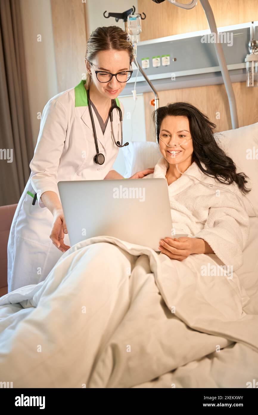 Brunette lady lying in hospital bed hi-res stock photography and images ...