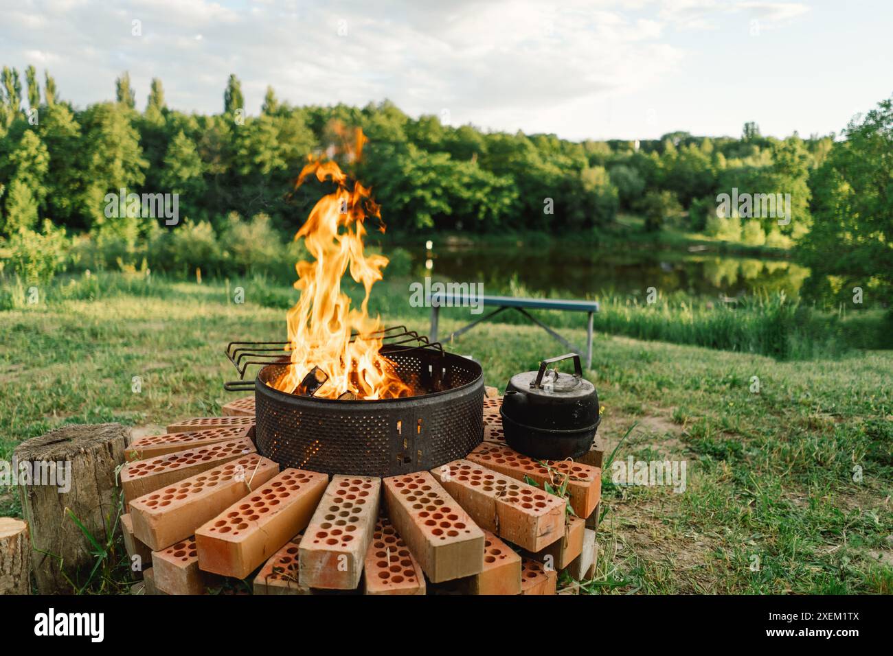 summer-barbecue-with-smoke-and-kettle-by-a-river-stock-photo-alamy