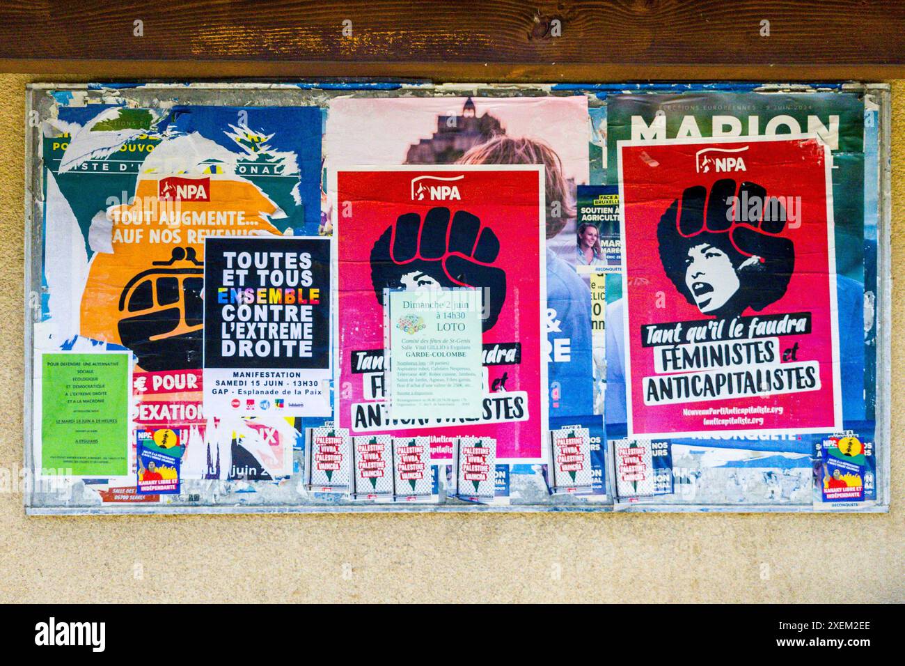 Montrond, France. 17th June, 2024. Posters of the NPA (New Anti-Capitalist Party) with the stylized portrait of Angela Davis stuck on a sign at the town hall in Montrond, France on June 17, 2024. Photo by Laurent Coust/ABACAPRESS.COM Credit: Abaca Press/Alamy Live News Stock Photo