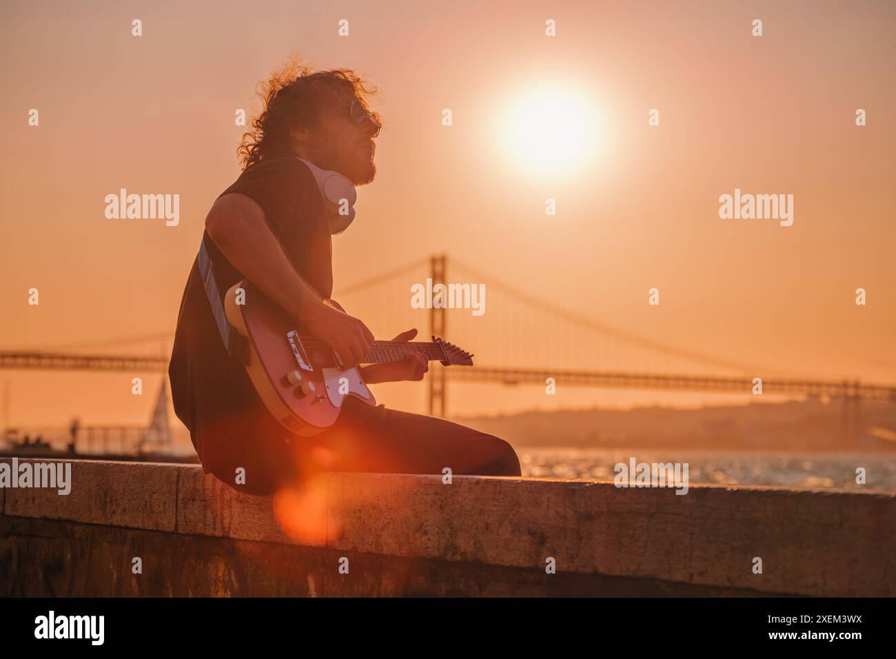 Street musician playing electric guitar in the street Stock Photo - Alamy