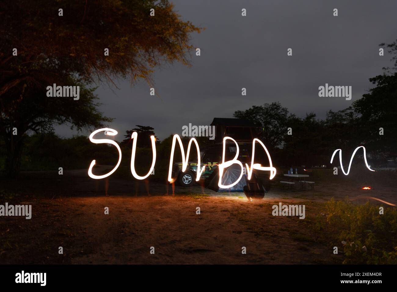 Light writing 'Sumba' at dark on a coastal beach, Pantai Puru Kambera, in East Nusa Tengara, Indonesia Stock Photo