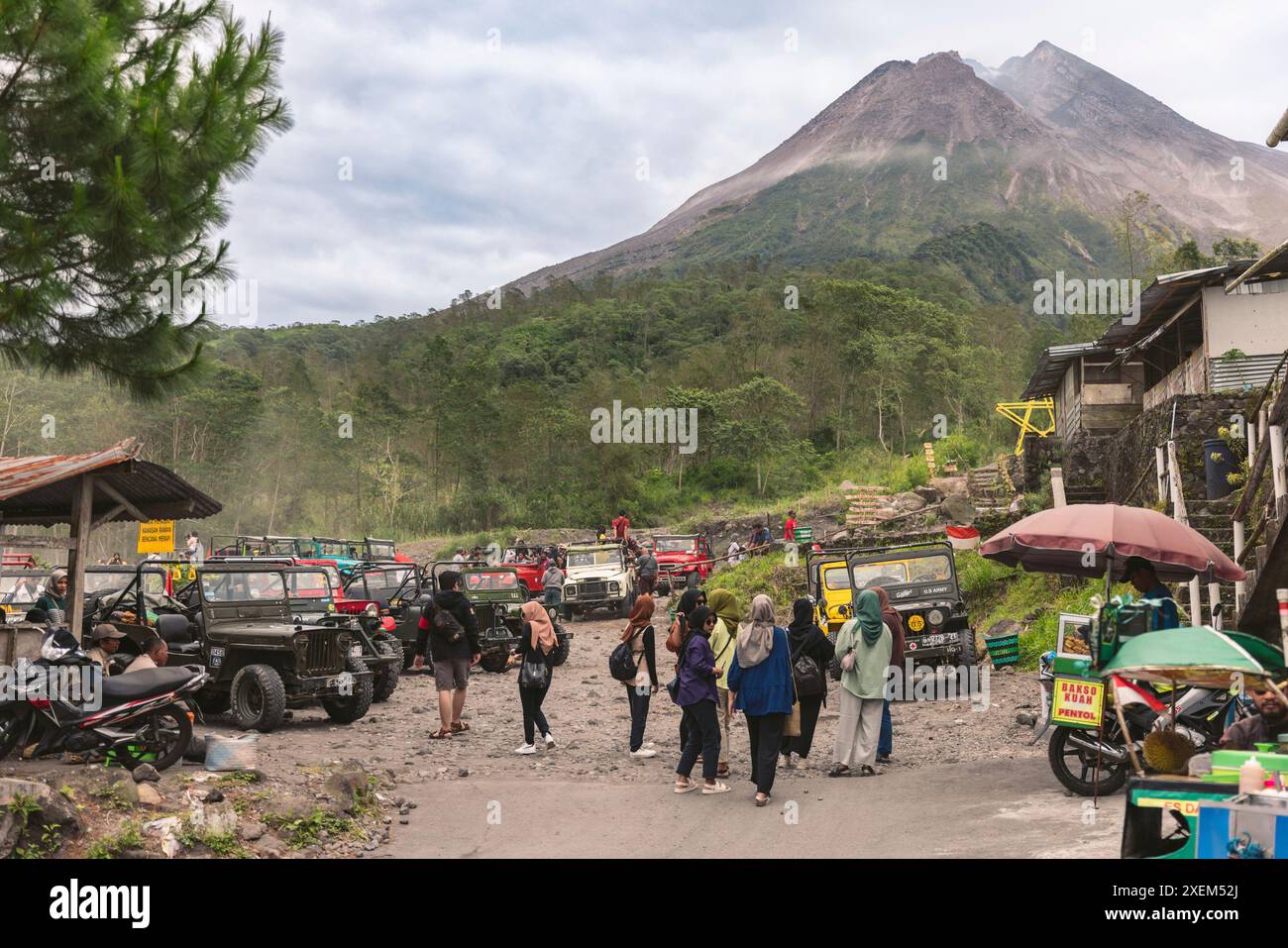 Tourists gather in a tourism area at the base of Mount Merapi in ...