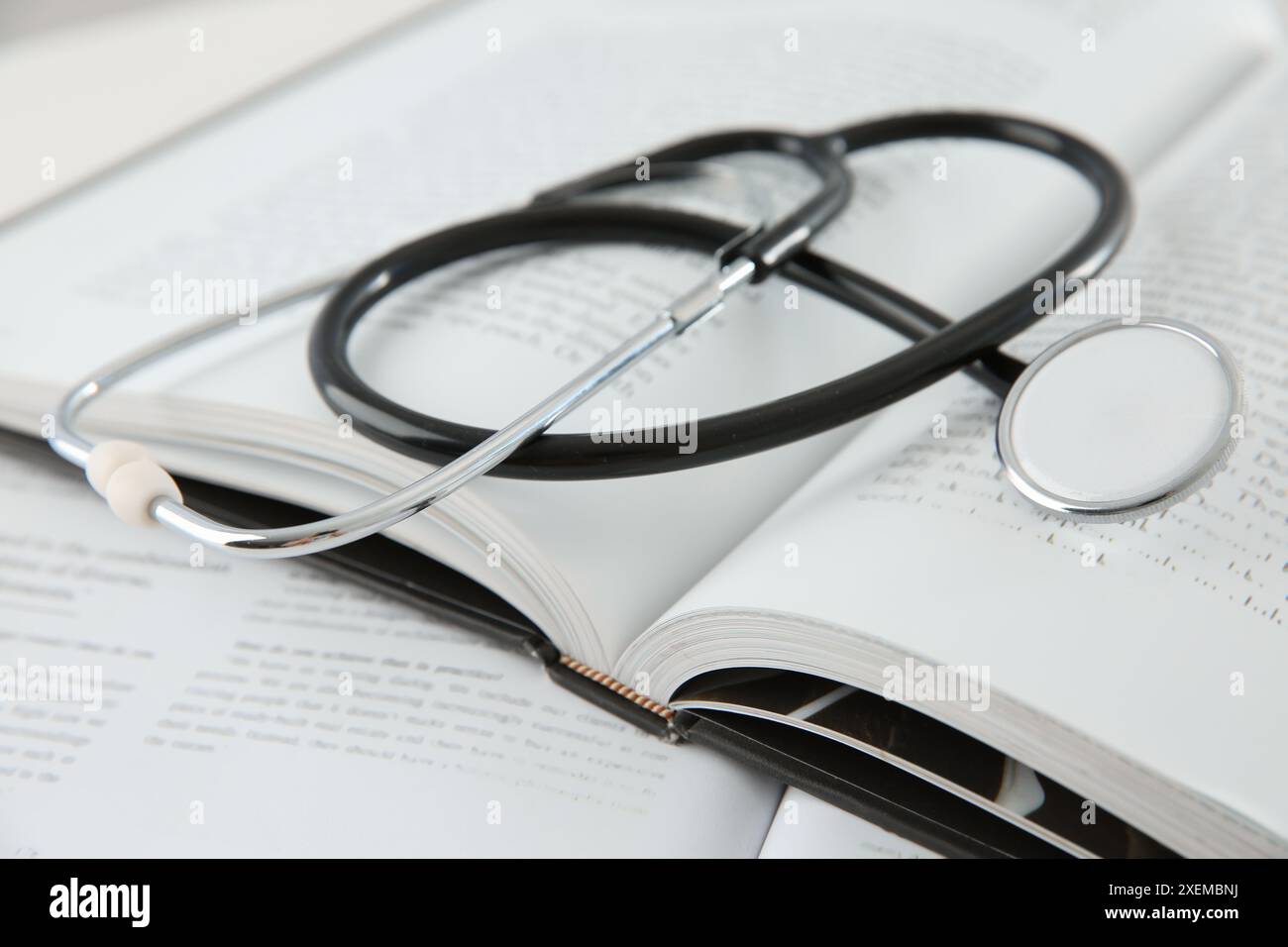 Black stethoscope on book hi-res stock photography and images - Alamy