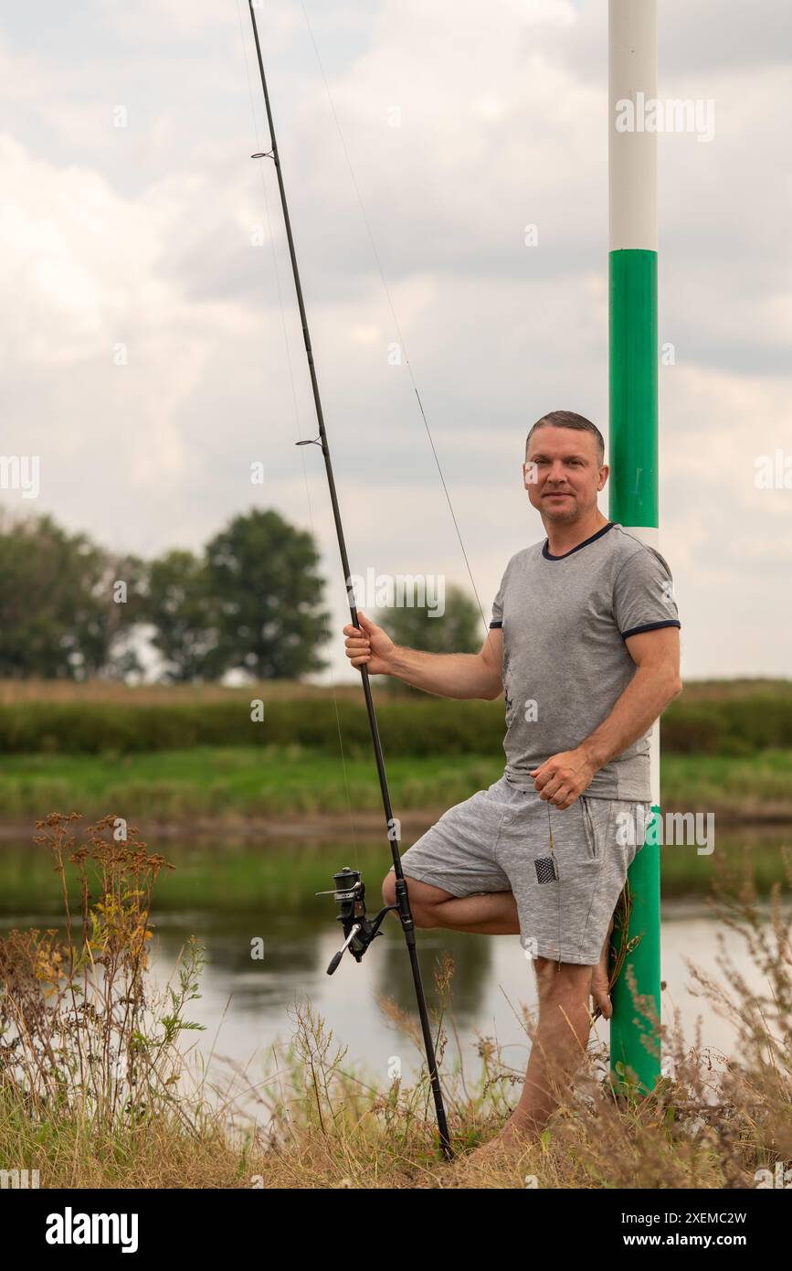 Person with rod hi-res stock photography and images - Alamy