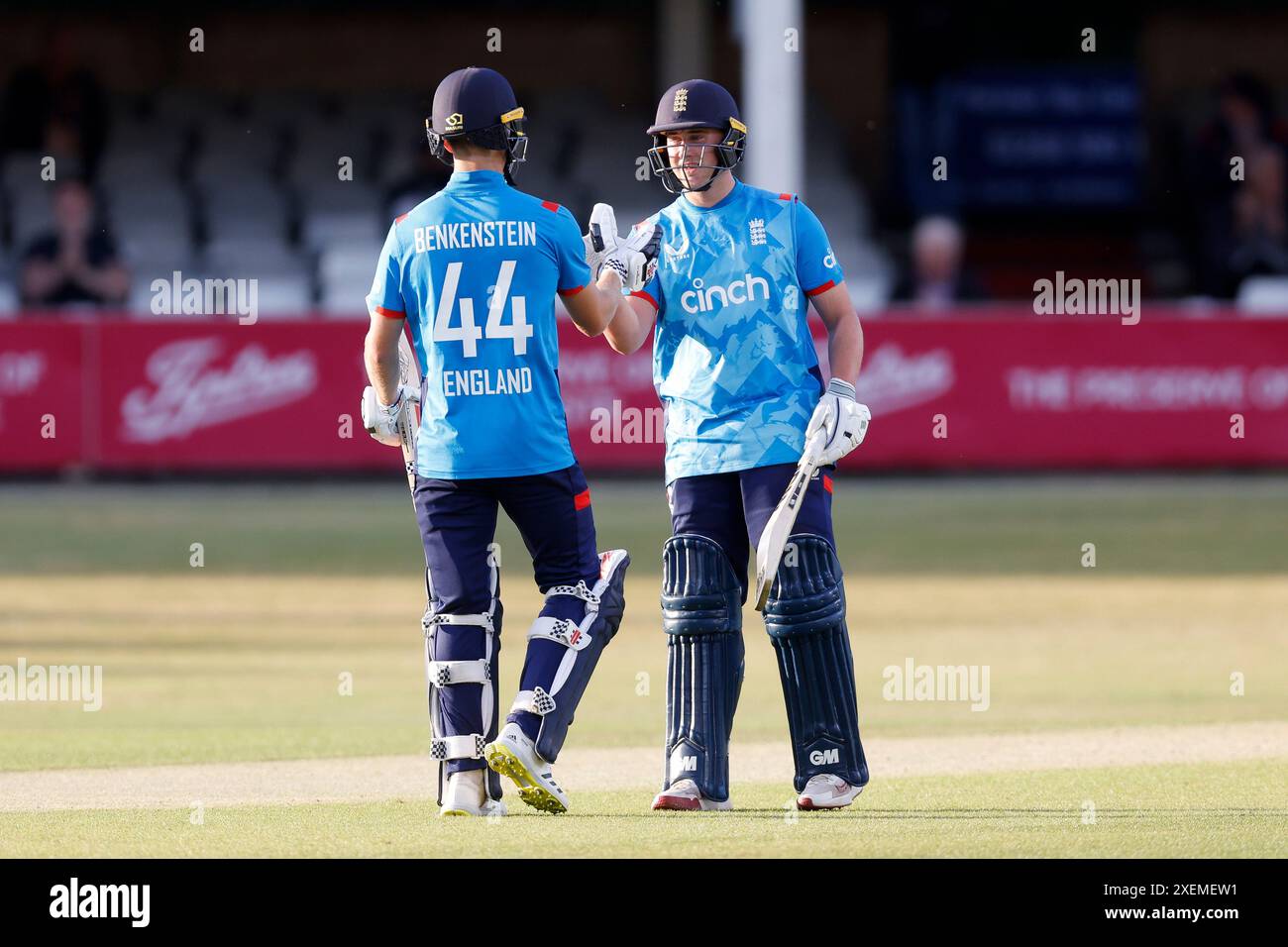 England's Luc Benkenstein reaches a half century and is congratulated by England's Noah Thain (right) during the first Youth One-Day International match at the Cloud County Ground, Chelmsford. Picture date: Thursday June 28, 2024. Stock Photo